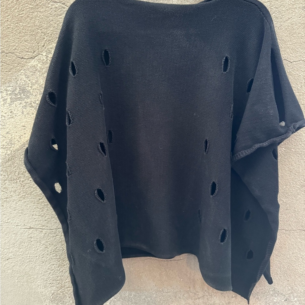 Angel brand poncho. Cutout holes